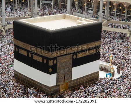 Kaaba the Holy mosque in Mecca with Muslim people pilgrims of Hajj praying in crowd (newest and very rare images of Holiest mosque after latest widening 2013-3014)