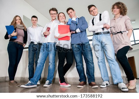 Students standing in a school hall posing
