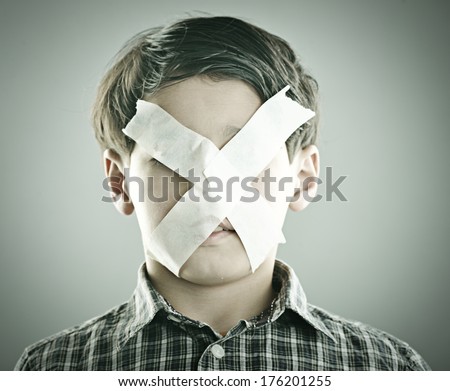 Portrait of kid with x shape on his face