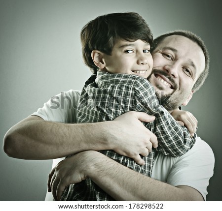 Father and son hugging in love