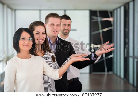Business team showing a welcome gesture with hands
