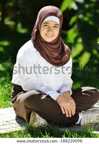 Beautiful Middle Eastern Arabic girl having happy time in nature