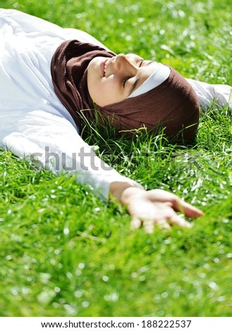 Beautiful Middle Eastern Arabic girl having relaxing time in nature
