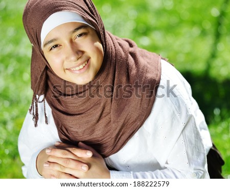 Beautiful Middle Eastern Arabic girl having happy time in nature
