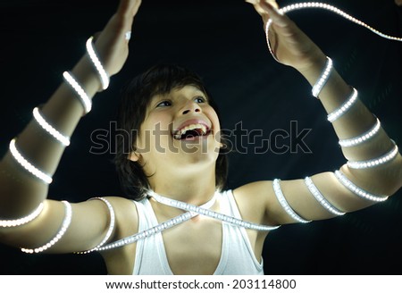 Portrait of kid with led strip light concept