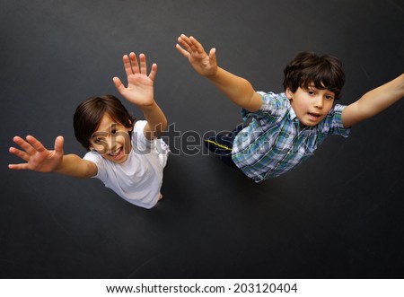 Child jumping on trampoline, high angle