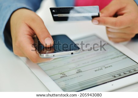 Human hand on tablet pc and credit card for shopping online