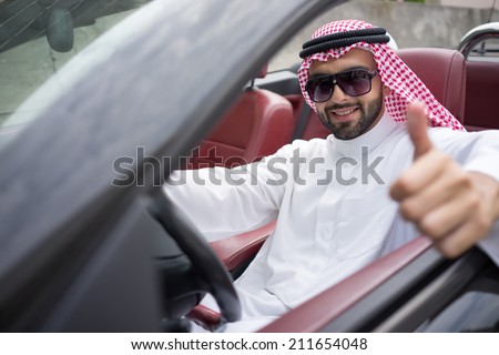 Arabic young businessman driving car