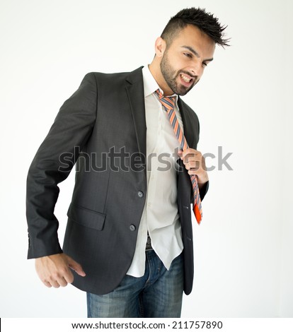 Portrait of attractive man pulling his tie and yelling