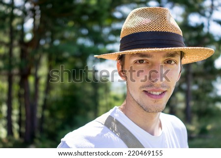 Young handsome man in nature