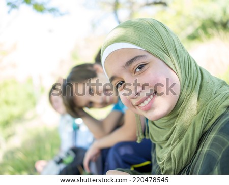 Beautiful Arabic girl with family enjoying in nature