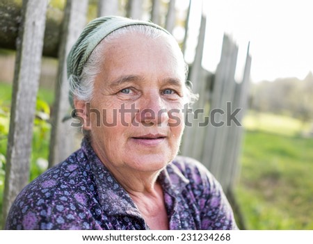 Portrait of senior country woman outdoors
