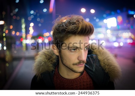 Young people on the night city street freezing of cold