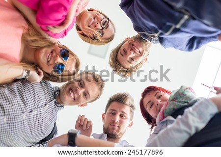 Group of happy young people in circle