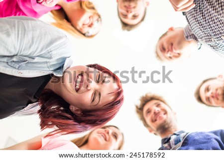 Group of happy young people in circle