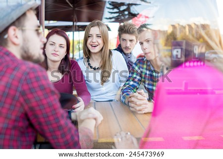Group of young happy people enjoying and having fun