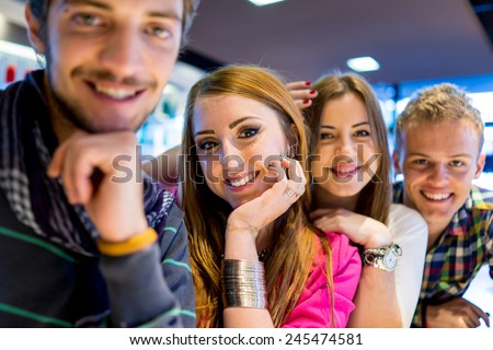 Group of young people enjoying and having fun smiling