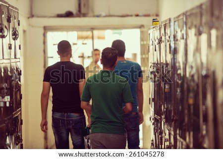 Young Arabic people in locker room at university