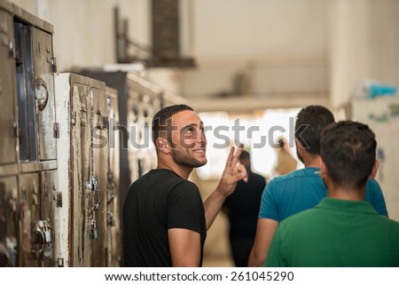 Young Arabic people in locker room at university