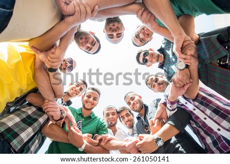 Happy young people in circle