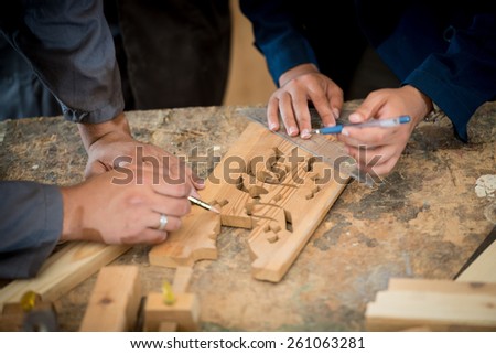 Craft workers in wood factory