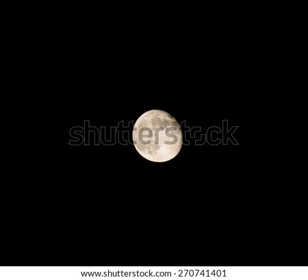 Moon over dark black sky at night