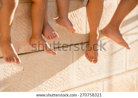 Group of happy children feet