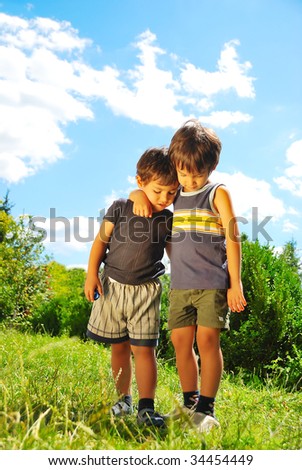 Two brother hugging each other outdoor