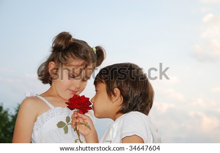 Beautiful scene of a boy and girl with rose
