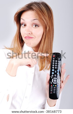 Attractive female pointing on remote control
