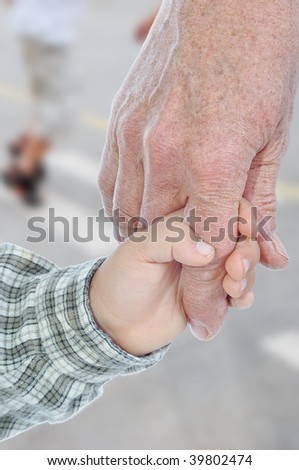 Young and elderly hands