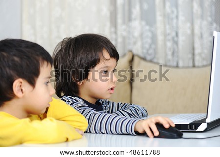 Childhood, laptop, learning and playing