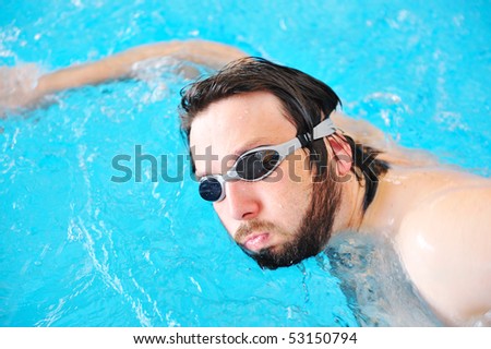 On beautiful pool, summer great time! Sport man swimming