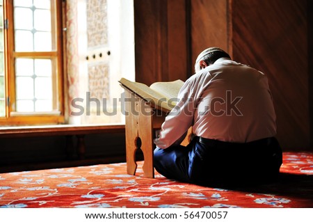 Prayer in mosque reading Koran Prayer in mosque reading Koran