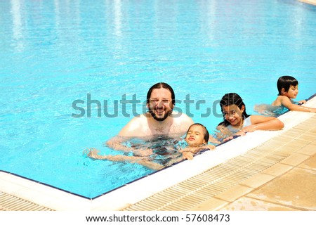 Happy family in pool