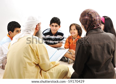 Education activity in Ramadan, Muslim arabic couple and children reading Koran