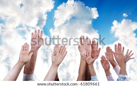 Many hands rising the sky together, children and adults - stock photo