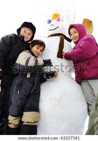 Children Playing In The Snow. Group of children playing