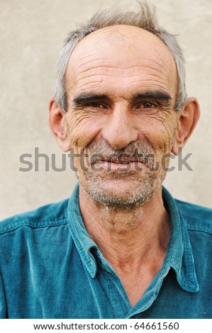 Elderly bald man, natural smile and positive grimace
