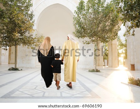 Muslim arabic traditional oriental family walking together, beautiful ambient in front of the mosque