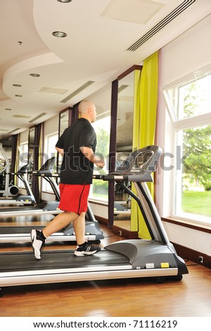 Man jogging indoor, running