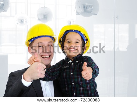 Happy boss and employee together, father and son engineers on work playing