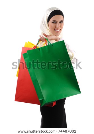 Beautiful Muslim traditional but modern woman holding shopping bags Beautiful Muslim traditional but modern woman holding shopping bags