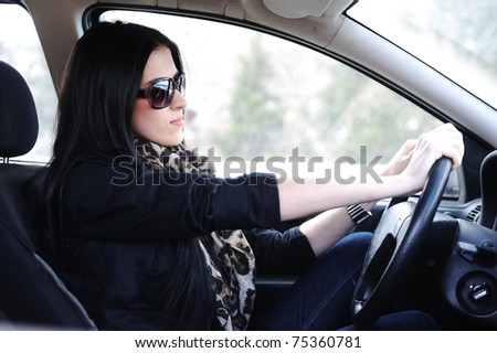 Woman Sitting In Car And Driving