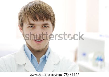 Portrait of young researcher in the lab, hospital worker smiling face