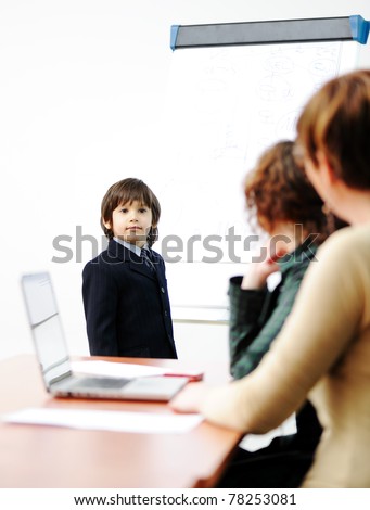 Genius kid on business presentation speaking to adults and giving them a lecture