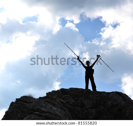 Silhouette of a woman during and advantage climbing and mountain walking