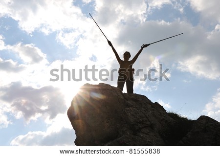 Silhouette of a woman during and advantage climbing and mountain walking
