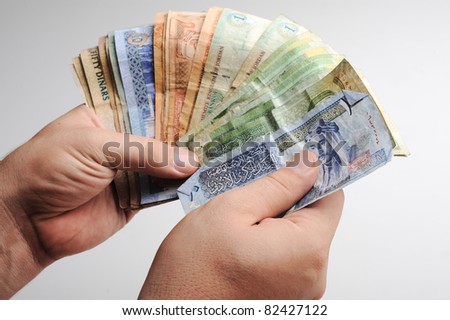 Counting arabic money in hands