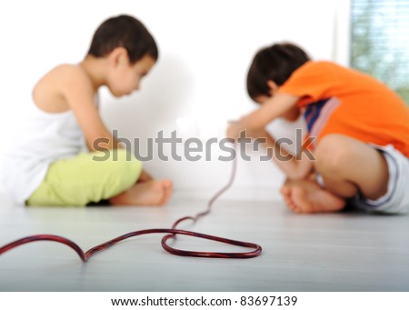 Dangerous game, children experimenting with electricity